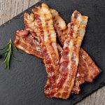 Closeup Of Slices Of Crispy Hot Fried Bacon